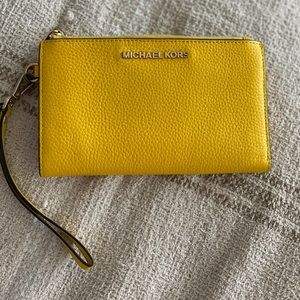 Michael Kors pebble leather wristlet.
